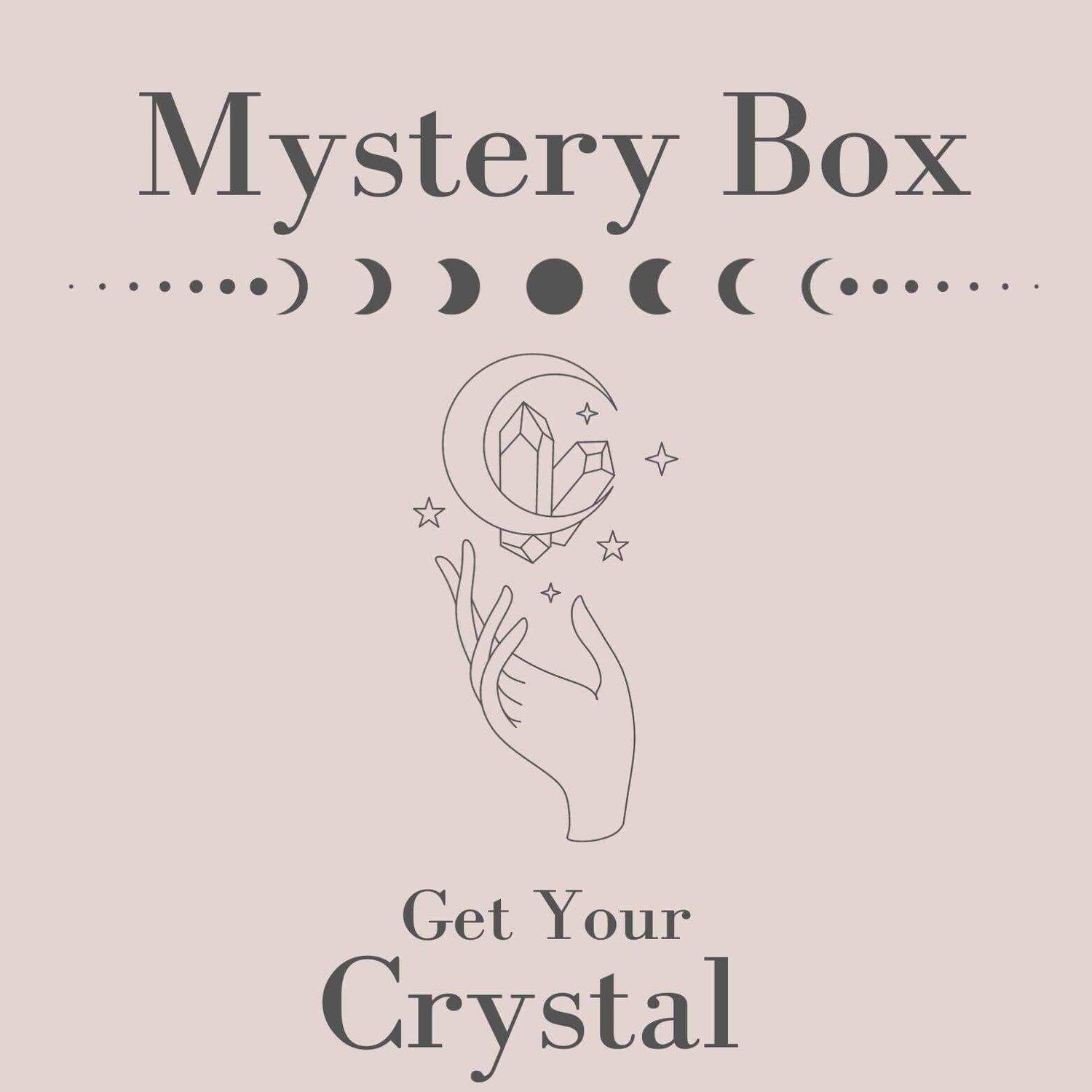 Mystery Box graphic featuring a hand holding a crystal with celestial symbols, inviting users to explore unique crystals.